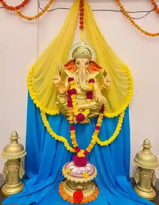 Ganesh Chaturthi home decoration with golden Ganesh idol and floral garlands | Golden Ganesh with Floral Aura | Ganesh Chaturthi Decoration | Decorations Guru